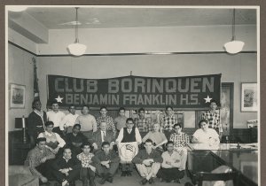 Students lined up for a group photo in front of a "Club Borinquen Benjamin Franklin H.S." banner