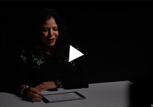 Still image of a videotaped reading by Kaliris Salas-Ramirez